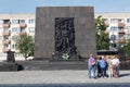 Tourists group visiting the Monument to the Ghetto Heroes in Warsaw, Poland