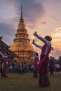 Tourists and groups of female dancers dancing in the area of Wat Phra That Haripunchai, Lamphun Province