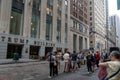 Tourists with guide gather in front of Trump Tower Building NYC