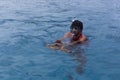 A tourists guide showing a turtle in the sea