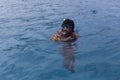 A tourists guide showing a turtle in the sea