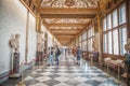 Tourists in hallway of the Uffizi Gallery in Florence