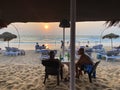 Tourists hanging out over sundowners at a beach shack in Goa Royalty Free Stock Photo