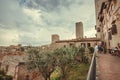 Tourists having dinner in taverna or traditional restaurant in ancient Tuscan town Royalty Free Stock Photo