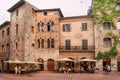 Tourists having dinner in taverna or traditional restaurant in ancient Tuscan town Royalty Free Stock Photo