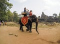 Tourists having an Elephant ride at Angkor Wat Temple - Siem Reap, Cambodia
