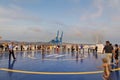 Tourists in Helipad for helicopter on the upper deck of big cruise ship