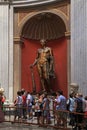 Tourists and Hercules sculpture in Vatican museums, Rome, Italy Royalty Free Stock Photo