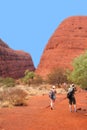 Couple is hiking in the Olgas mountains, Nothern Territory, Australia