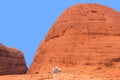 Tourists are hiking along the Olgas mountains,Northern Territory,Australia