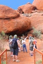 Tourists hike in the Olgas mountains,NT, Australia