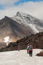 Tourists hiking at Dzenzur Volcano, Nalychevo Nature Park, Kamchatka Krai, Russia