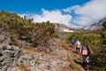 Tourists hiking at Dzenzur Volcano, Nalychevo Nature Park, Kamchatka Krai, Russia