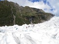 Tourists hiking on Fox Glacier, New Zealand