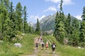 Tourists hiking towards the mountain in Slovakia, active lifestyle