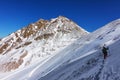 Tourists hiking in winter mountains in Kazakhstan.