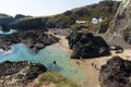 Tourists and holidaymakers enjoying late summer sunshine at Kynance Cove beach The Lizard Cornwall England UK Royalty Free Stock Photo