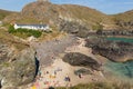 Tourists and holidaymakers in summer sunshine at Kynance Cove beach The Lizard Cornwall England UK