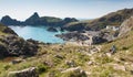 Tourists and holidaymakers walking down to the beach to enjoy late summer sunshine at Kynance Cove beach The Lizard Cornwall