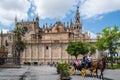 Tourists on a Horse and Carriage Ride in Plaza Nuevo Royalty Free Stock Photo