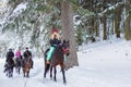 December 9, 2017, Russia, Arkhyz: Tourists on horse rides through snowy landscape