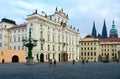 Tourists are on Hradchanskaya Square in Prague, Czech Republic. View of Archbishop`s Palace, Prague Castle Royalty Free Stock Photo