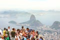 Tourists huddled at Christ the Redeemer lookout point to take a picture of Guanabara Bay, in the background the city of Niteroi Royalty Free Stock Photo