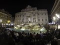 Tourists at Illuminated Fontana Di Trevi, Trevi Fountain at night, Rome, Italy April, 2019