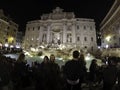 Tourists at Illuminated Fontana Di Trevi, Trevi Fountain at night, Rome, Italy April, 2019