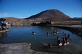 Tourists inside hot springs Royalty Free Stock Photo