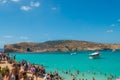 Tourists ist swimming at Blue Lagoon, Comino, Malta