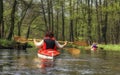 Tourists kayaking on river