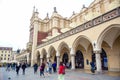 Tourists at Krakow Cloth Hall located in center of town square in the Krakow, Poland