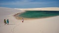 Tourists, lagoon and dunes at Lencois Maranhenses National Park, Maranhao, Brazil Royalty Free Stock Photo