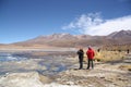 Tourists in the lagoon with flamingos in Uyuni, Bolivia