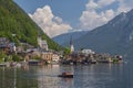 Tourists lake cruise boat on Hallstattersee by the World Heritage lakeside town in the Alps, Hallstatt, Salzkammergut, Austria Royalty Free Stock Photo