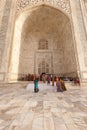 Tourists leave tomb portico at the Taj Mahal