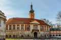 Tourists in Libechov, old abandoned baroque castle in central Bohemia,Czech republic.Romantic building with tower,red facade and