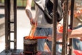 Tourists light incense candles at a Buddhist temple