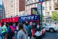 Tourists lining up to board a red double decker sightseeing bus in Manhattan New York Royalty Free Stock Photo