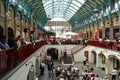 Tourists listen to a singer in Covent Garden