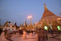 Tourists and local Devotees in crowded Shwedagon Pagoda in the evening during sunset Royalty Free Stock Photo