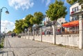 Tourists and local Germans enjoy the colorful, touristic boardwalk promenade on the Baltic Coast of Warnemunde Rostock Germany