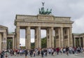 Tourists and local people at the Brandenburger Tor (Brandenburg Gate). Berlin, Germany.