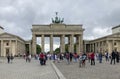 Tourists and local people at the Brandenburger Tor (Brandenburg Gate). Berlin, Germany.