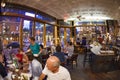 Tourists and local people enjoy the restaurant at the Orchard st