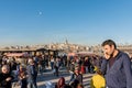 Tourists and local people explore eminou square