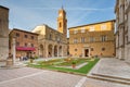 Tourists and local people on the Piazza in the old town of Pienza