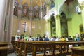 Tourists and local people at the Sunday mass in Church of the Holy Redeemer