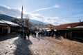 Tourists and local people walk through the street